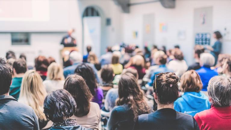 a large group of people attend a University-sponsored event; get event tickets